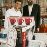 Rabbi Eliyahu Shear and Orphan Chatan Receiving Gifts from Chessed Ve'Emet
