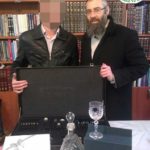 Rabbi Eliyahu Shear and Orphan Chatan Receiving Gifts from Chessed Ve'Emet