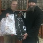 Rabbi Eliyahu Shear and Orphan Chatan Receiving Gifts from Chessed Ve'Emet